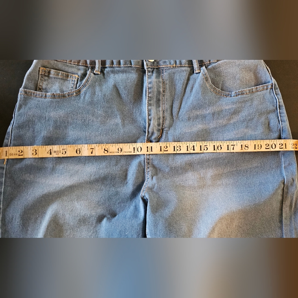 Never worn, New. 1 X Jean shorts with fringed cut off. Knee length.